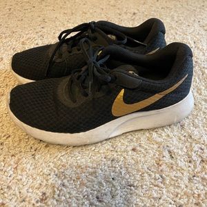 Nike black and gold sneakers